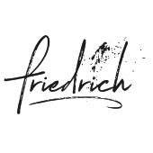 Das Wort 'Friedrich' ist in kursiver schwarzer Tinte auf weißem Hintergrund geschrieben. Die Buchstaben scheinen leicht verschmiert zu sein, möglicherweise durch Handhabung.