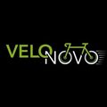 Das VeloNovo-Logo zeigt den Schriftzug 'VeloNovo' in Grün mit einem Fahrrad-Symbol daneben, beides auf schwarzem Hintergrund.