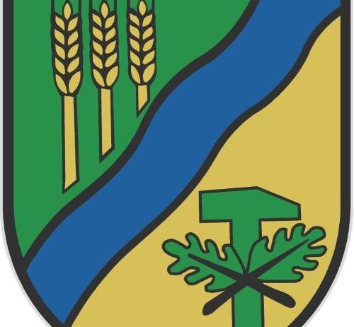 Ein grüner Schild mit drei Weizenähren, einem blauen Fluss und einem grünen gekreuzten Baum.