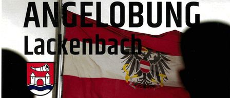 Ankündigungsposter mit einer Flagge mit einem Adler, einem Schlosslogo und dem Datum 06.02.2026. Die Veranstaltung findet im Veranstaltungsplatz, Lackenbach, um 16:30 statt.
