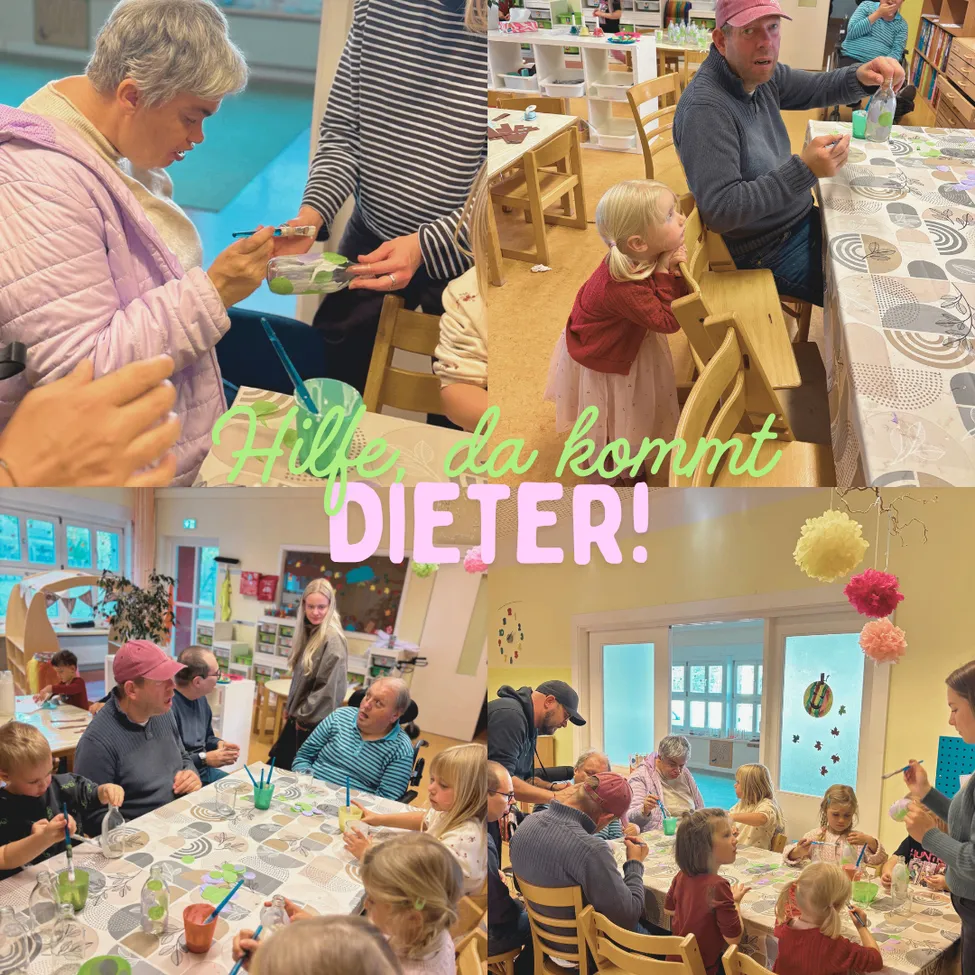 A group of people are gathered in a room, some sitting at tables and others standing. They are engaged in an activity, possibly painting or crafting. The room is decorated with colorful papers and balloons.