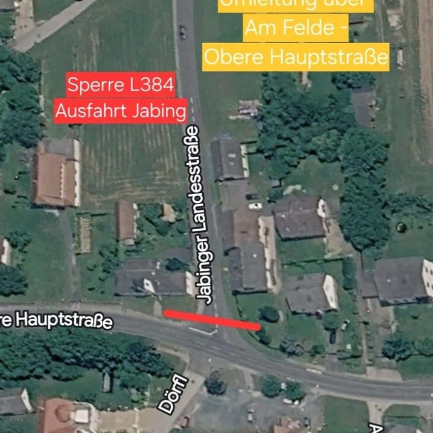 Eine Karte zeigt die Stadt Jabing mit Straßen wie Obere Hauptstraße, Jabinger Landesstraße und Am Felde. Eine hervorgehobene rote Linie zeigt einen bestimmten Weg an.