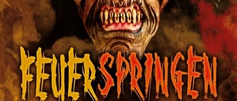 Ein dämonisches Gesicht mit Hörnern und scharfen Zähnen vor einem feurigen Hintergrund. Die Worte 'Feuerschringen' sind in oranger Schrift prominent angezeigt.