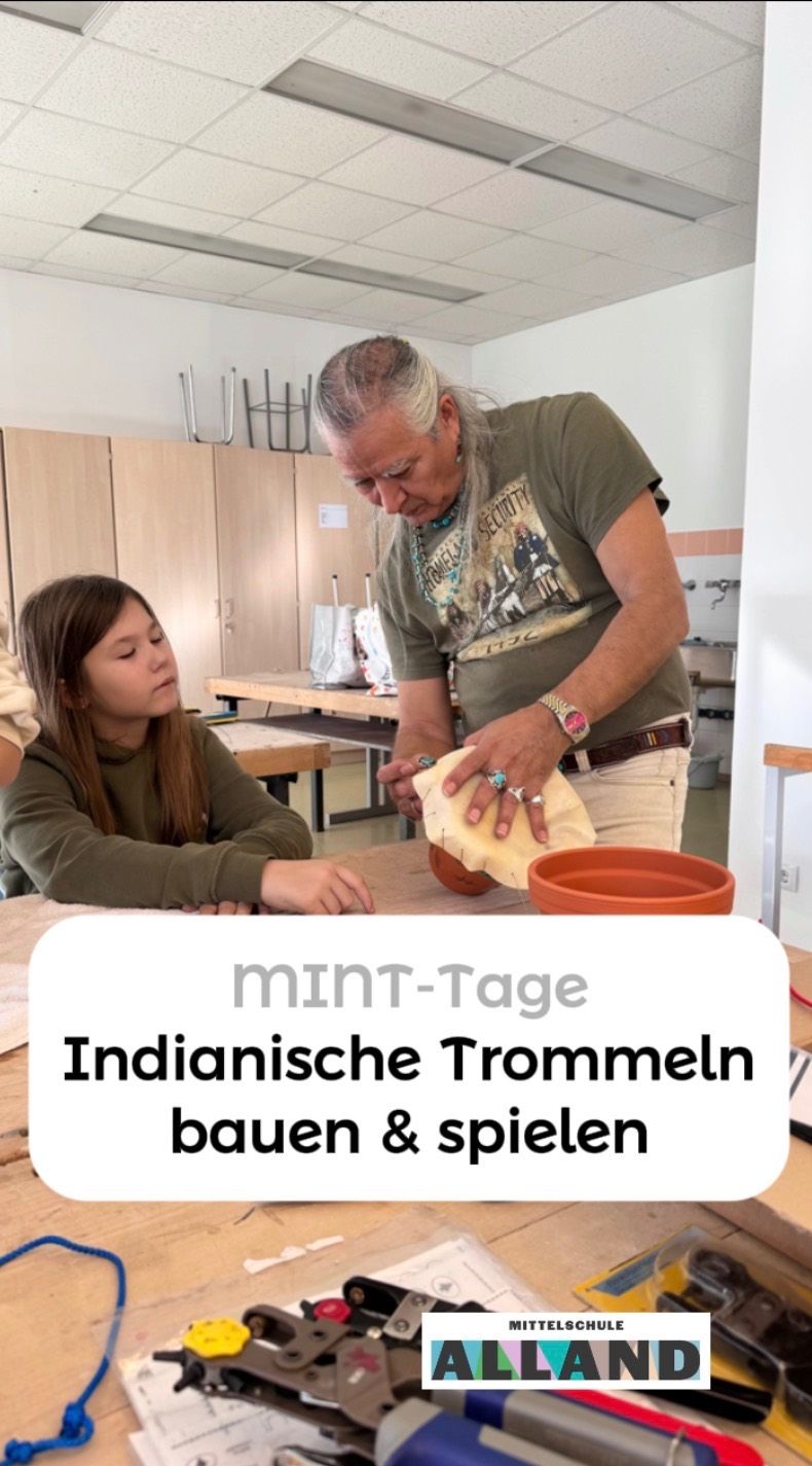 A man and a girl are making an Indian drum. They are in a room with cabinets and a table. The man is focused on his task, while the girl watches.