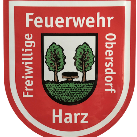 Das Emblem der Freiwilligen Feuerwehr Harz zeigt zwei Bäume und eine Bank, eingerahmt von einem roten Schild. Der Text lautet 'Feuerwehr Freiwillige Obersdorf'.