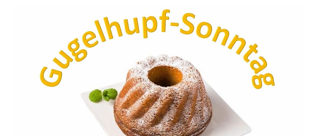 Ein Gugelhupf-Kuchen mit Puderzucker und Minzblättern auf einem weißen Teller mit dem Text 'Gehupf-Sonne'.