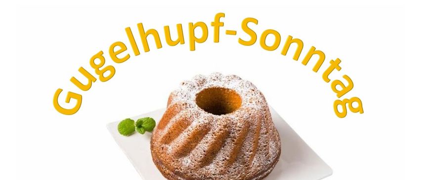 Ein Gugelhupf-Kuchen mit Puderzucker und Minzblättern auf einem weißen Teller mit dem Text 'Gehupf-Sonne'.