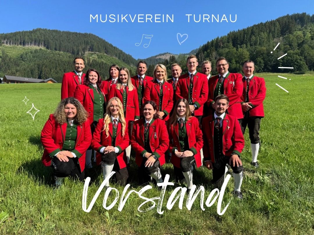 Eine Gruppe von Menschen in roter und grüner traditioneller Kleidung posiert für ein Foto auf einer Wiese mit Bergen im Hintergrund. Der Text 'Vorstand' steht in Weiß unten.