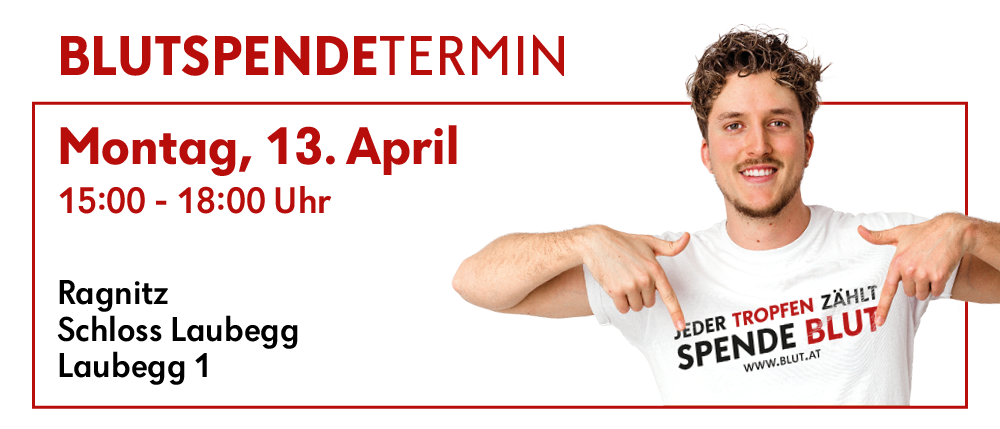 Ein Mann zeigt auf sein T-Shirt mit dem Slogan 'Jeder Tropfen zählt' und 'Spende Blut' bei einer Veranstaltung am 13. April.