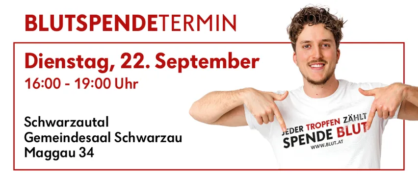 Ein lächelnder Mann zeigt auf ein Plakat, das eine Veranstaltung namens 'AUSPENDETERMIN' am Montag, 22. September von 0 bis 19:00 Uhr im Varzautal Eindessaal Schwarzau, Hausnummer 34, ankündigt. Das Plakat hat einen roten Rand und weißen Hintergrund.