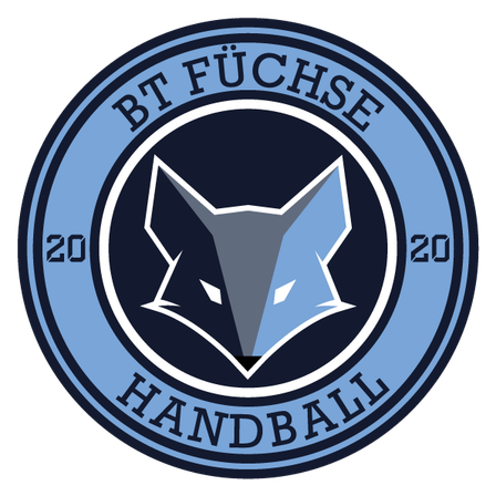 Ein kreisförmiges Emblem mit dem Text 'BT FUCHSE' oben und 'HANDBALL' unten. In der Mitte ist ein stilisierter Wolfskopf. Die Zahlen '20' befinden sich auf der linken und rechten Seite. Der Hintergrund ist schwarz.