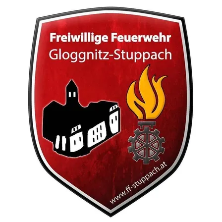 Das Logo der Freiwilligen Feuerwehr Glognitz-Stuppach zeigt ein Gebäude, eine Flamme und ein Zahnrad mit einer Website-Verknüpfung.