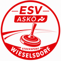 Das Logo für ESV ASKO Stocksport Wieselsdorf zeigt einen roten Kreis mit einem stilisierten Drehteller in der Mitte, umgeben von roten und weißen Linien. Der Text 'ESV ASKO' steht in Weiß über dem Drehteller und 'STOCKSPORT' steht in Weiß darunter.
