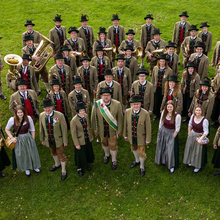 Image contains, People, Person, Group Performance, Music Band, Musical Instrument, Tuba, Shoe, Grass, Hat, Groupshot
