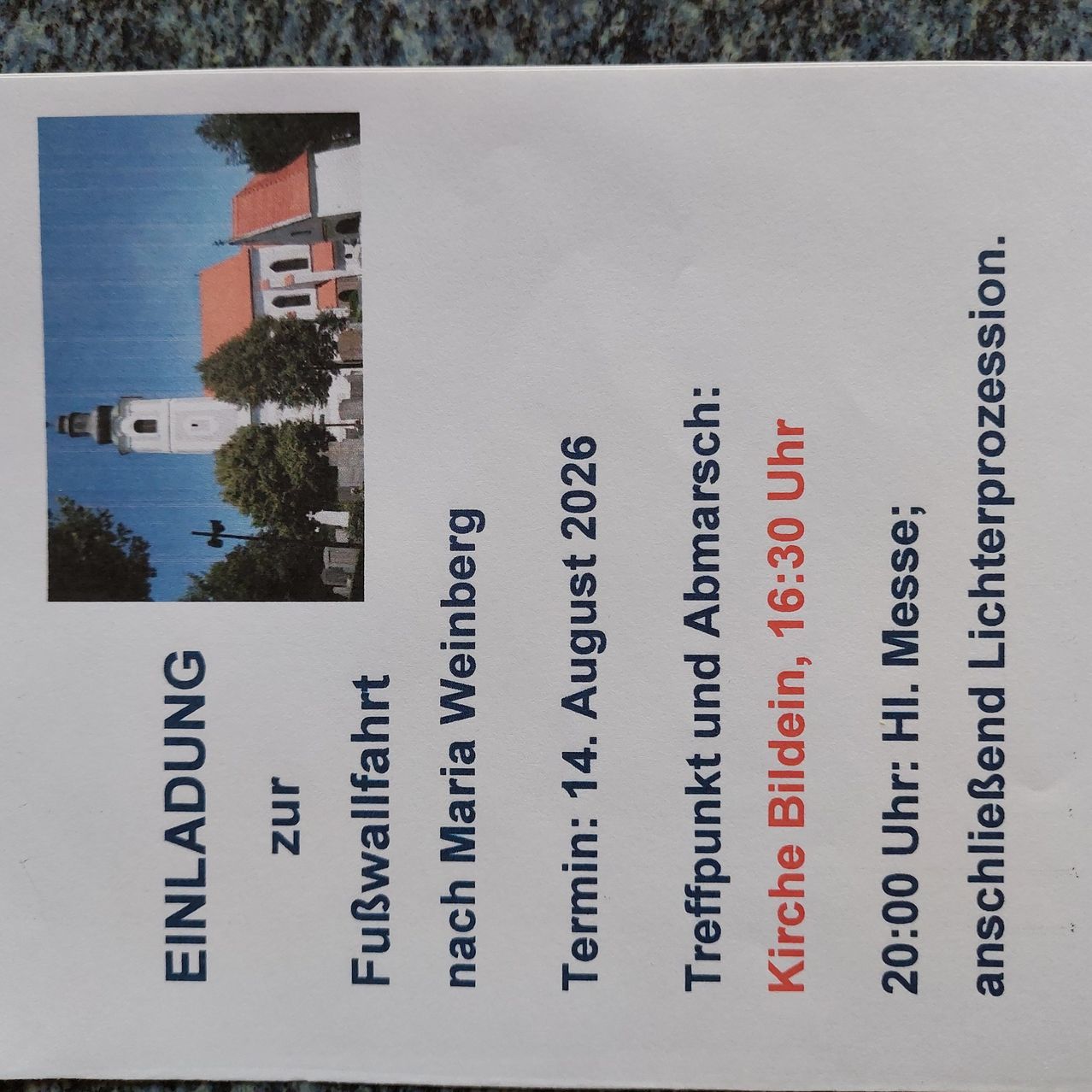 Ein Flyer mit einem Bild einer Kirche und Text auf Deutsch über eine Veranstaltung am 14. August 2026.