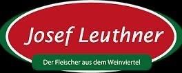 The logo for Josef Leuthner, a butcher from the wine region, features a red oval with white text on a black background.