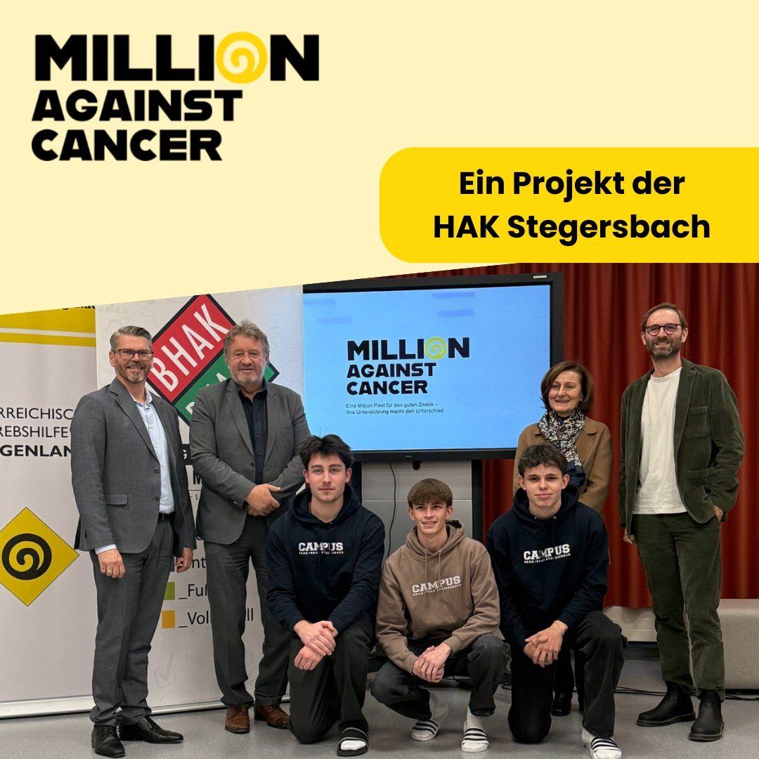 Eine Gruppe von Menschen steht gemeinsam vor einem Bildschirm mit den Worten Million gegen Krebs. Sie lächeln und posieren für ein Foto.