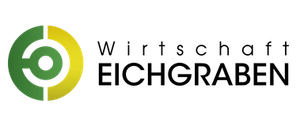 Ein kreisförmiges Logo mit grünen und gelben Farben auf schwarzem Hintergrund.