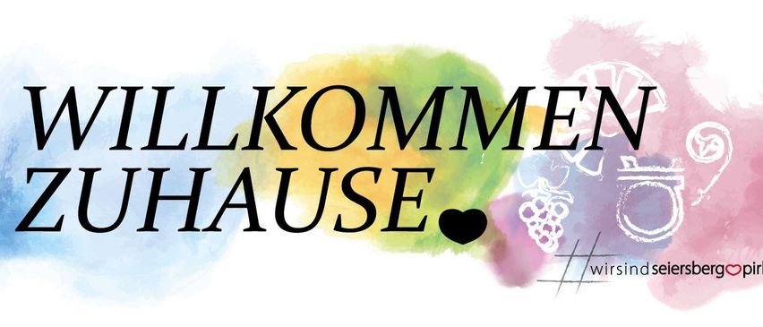 Willkommen bei Hause, ein Markenlogo mit dem Text 'Willkommen Hause' in fetter schwarzer Schrift auf einem farbenfrohen Aquarellhintergrund.