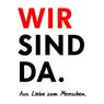 Ein kühner weißer Poster mit den roten Worten 'WIR SIND DA'. Darunter steht in Schwarz 'Aus Liebe zum Menschen'. Das Design ist einfach, zentriert, und der Hintergrund ist weiß.