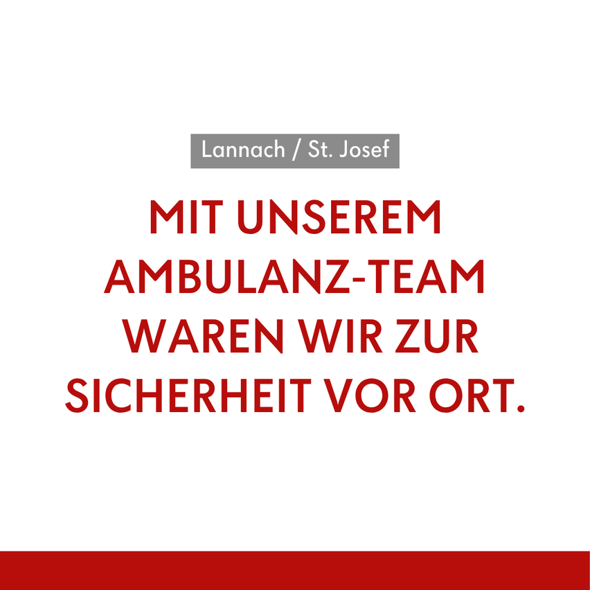 Ein weißer Plakat mit rotem Text lautet 'Mit unserem Ambulanz-Team waren wir vor Ort für Sicherheit.' Die Namen Lannach und St. Josef sind darüber angezeigt.