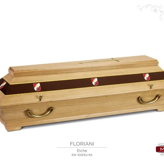 Ein hölzerner Sarg mit einem Kreuz auf der Oberseite und goldenen Griffen. Der Sarg hat einen braunen Rand mit roten Emblemen. Der Markenname Floriani ist unter dem Sarg angezeigt.