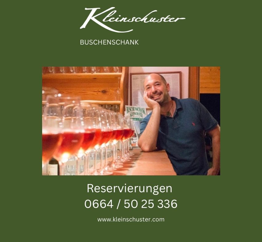 An advertisement for Kleinschuster, a wine bar with a smiling man behind a bar of wine glasses. Contact information and website are provided.