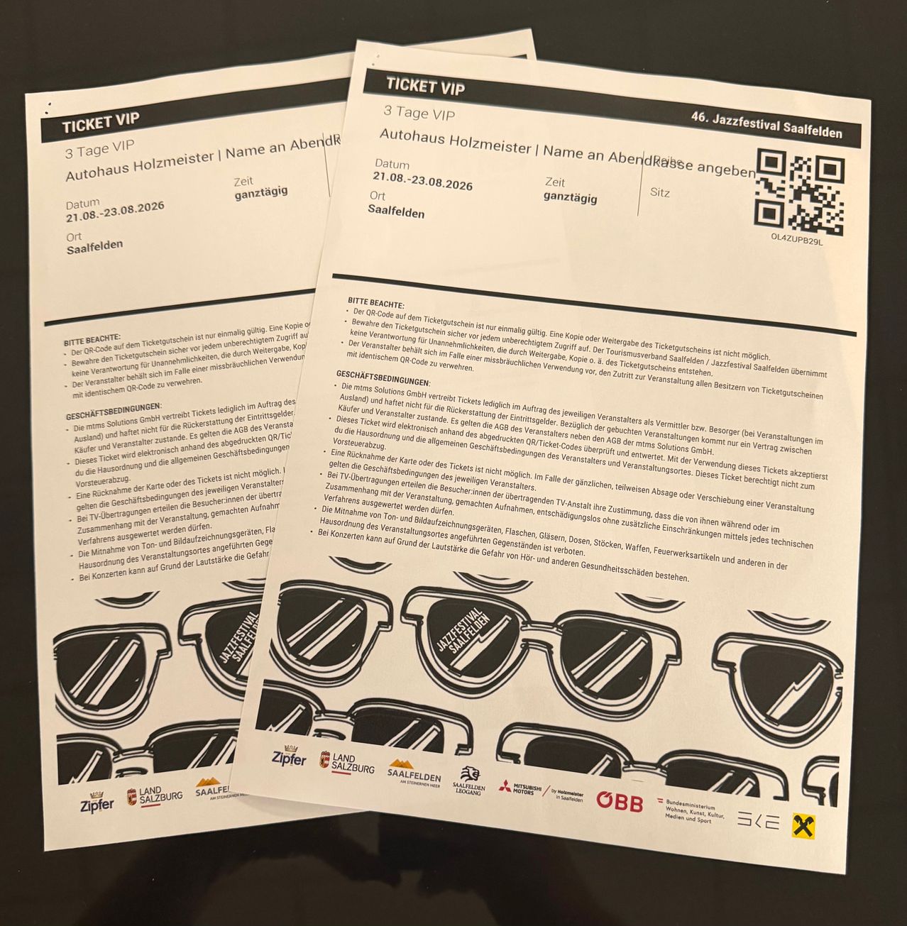 Two VIP tickets for the 46th Jazzfestival Saalfelden, valid for three days, displayed on a black surface. The tickets include a QR code and specific dates for entry and exit.
