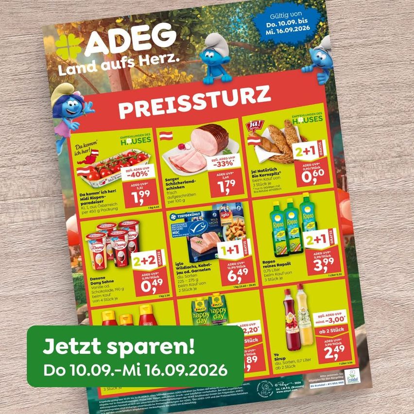 Advertisement for ADEG Land aufs Herz featuring various food products with price reductions. The flyer includes images of Smurfs and the slogan 'Jetzt sparen!' The offer is valid from September 10 to September 16, 2026.