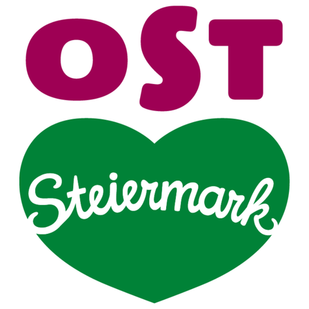 Ein herzförmiges Logo mit dem Wort 'OST' in fetten lila Buchstaben oben und 'Steiermark' in weißer Kursivschrift darunter.