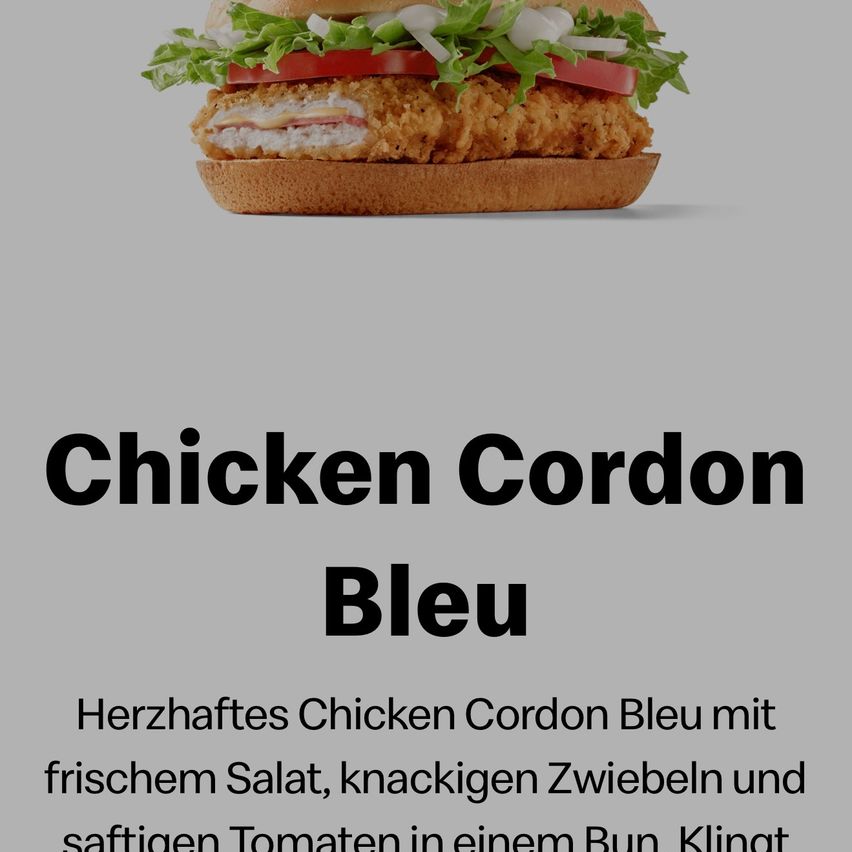 A Chicken Cordon Bleu sandwich with fresh lettuce, juicy tomatoes, crispy onions, and crispy chicken breast. Served on a bun.