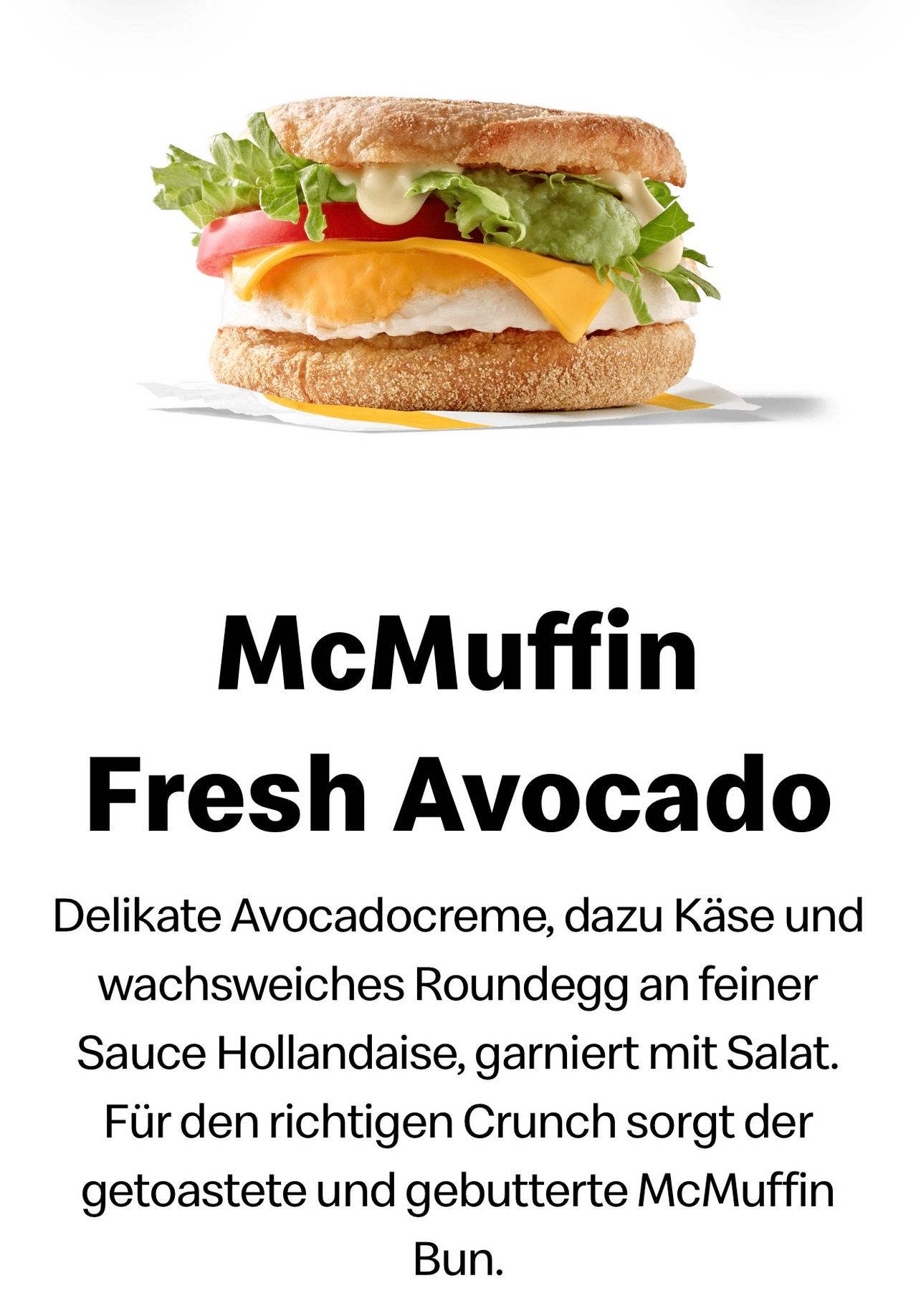 Ein Bild des McMuffin Fresh Avocado Sandwich mit zarter Avocadocreme, Käse und wachweichem Rundgemüse auf einem Bett aus Hollandaise-Sauce, garniert mit Salat, und begleitet von einer Beschreibung in Deutsch.