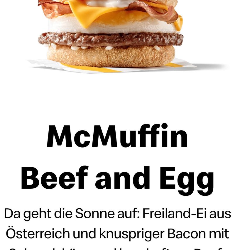 A McMuffin Beef and Egg sandwich with egg, cheese, bacon, and a beef patty on a toasted bun.