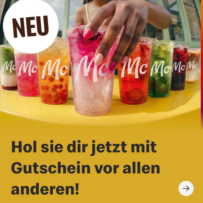 A hand holds a pink drink with a straw in a row of colorful drinks. The word 'NEW' is displayed prominently.