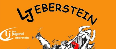 An orange poster features a cartoon dog biting into an apple with the text 'LJ Eberstein' and 'Mir Taugt De Sau!'. The background is bright orange.