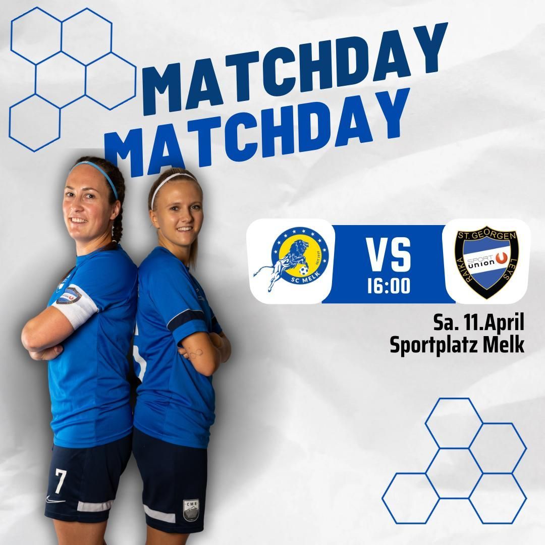Two women in blue uniforms stand together for a matchday photo. The poster behind them shows the teams VS SC Melk and St. Georgen. The match is on April 11 at Sportplatz Melk, starting at 4 PM.