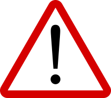 Ein rotes und weißes Dreiecksschild mit einem schwarzen Ausrufezeichen darin. Es ist ein Warnzeichen.