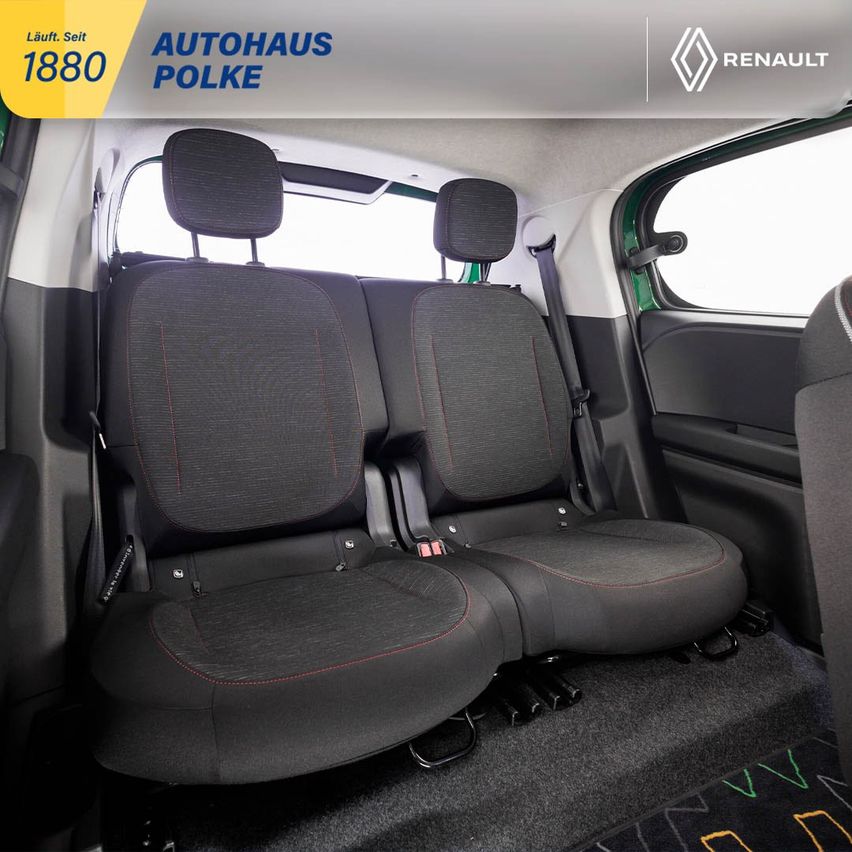 Die Rücksitze eines Renault-Fahrzeugs sind sichtbar. Sie sind grau mit roten Nähten und haben Kopfstützen.