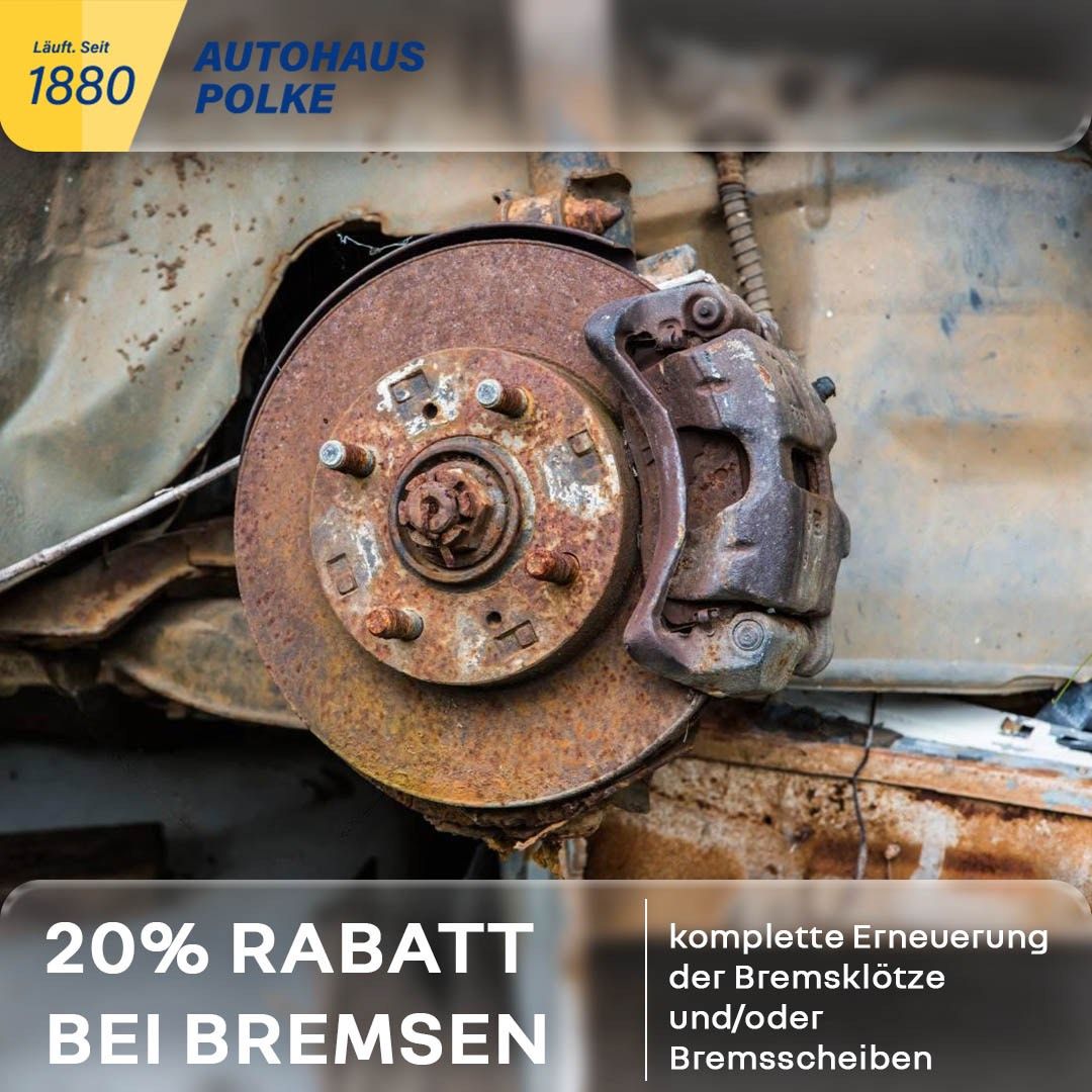 Rusty brake disc and pad on a vehicle. The text overlay reads '20% discount on brakes'. The background is blurred.