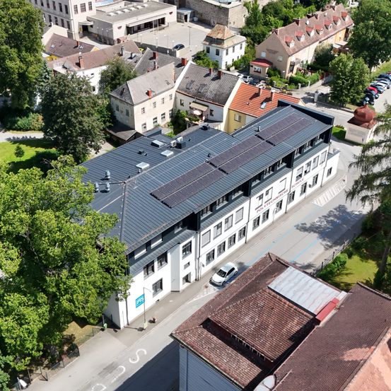 Image contains, Outdoors, Architecture, Building, Aerial View, Electrical Device, Solar Panels, Housing