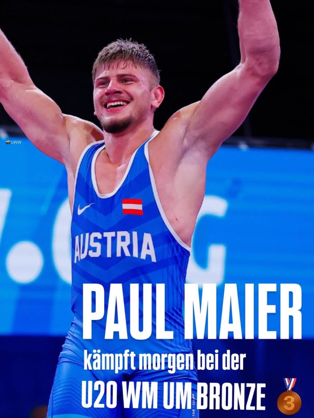 Paul Maier, an Austrian athlete, celebrates with his arms raised, wearing a blue tank top with the word Austria and his name on it. The background is a blue backdrop with a white circle and the text Paul Maier.