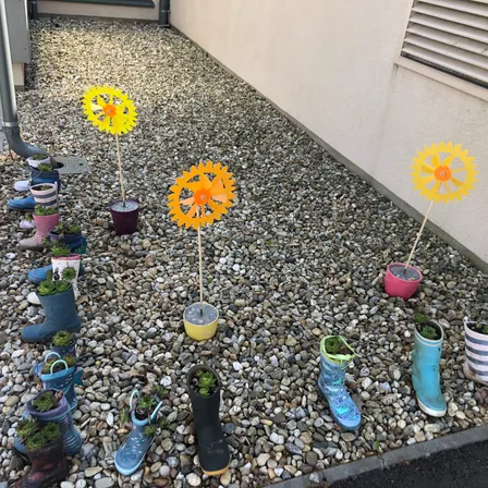 Pebble, Floor, Footwear, Shoe, Road, Outdoors, Pottery, Flooring, Wheel, Plant