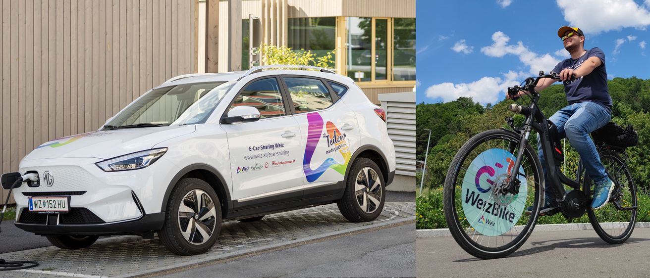 Ein weißer Elektrowagen mit einem farbenfrohen Design an der Seite ist am Straßenrand geparkt. Im Hintergrund befindet sich ein Gebäude mit Glasfenstern und einem Baum.