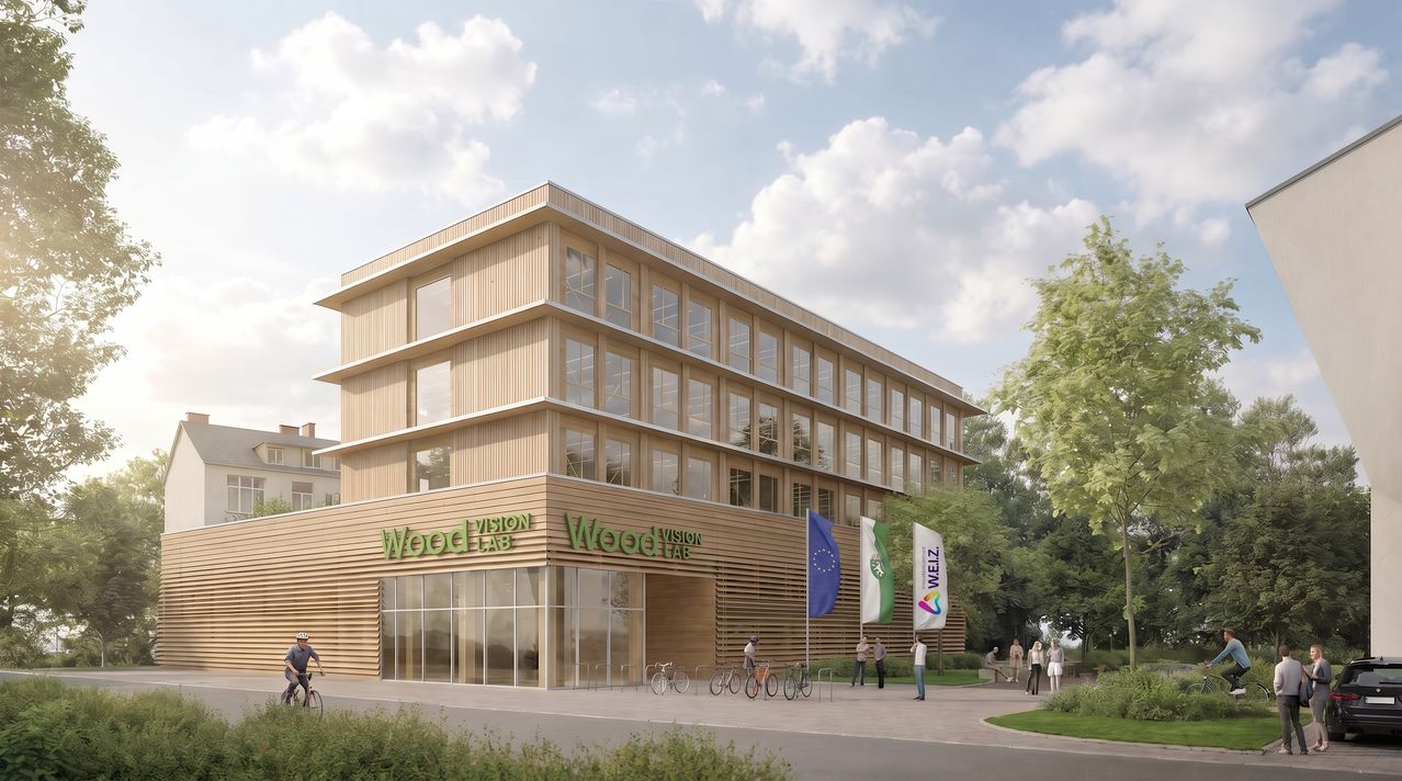 Eine architektonische Darstellung eines modernen Gebäudes namens Wood Vision Lab mit Glasfenstern und hölzerne Außenfassade. Fahrräder sind draußen geparkt und Leute gehen auf dem Bürgersteig. Flaggen sind vor dem Gebäude angebracht.