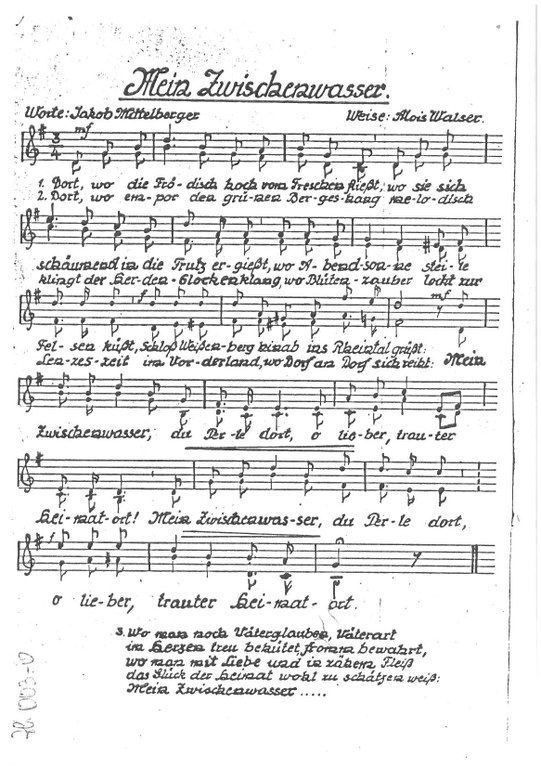 Eine alte Notenpartitur mit dem Titel 'Mein Zwischewasser' von Jakob Mittenberger. Die Texte sind in deutscher Sprache, begleitet von Noten. Die erste Zeile der Texte lautet 'Dort, wo die Fö- dis- hoch vom Freschen-'. Das Blatt enthält Noten, Text und eine Unterschrift am unteren Rand.