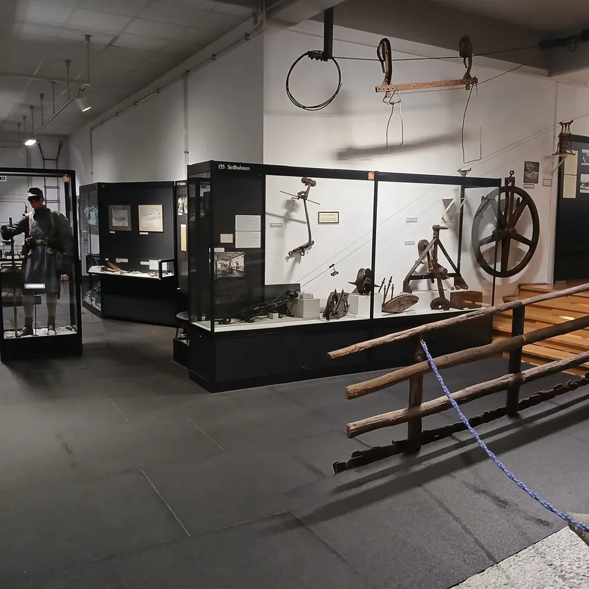 Architecture, Building, Indoors, Museum, Person, Wheel, Factory, Handbag, Coat, Manufacturing