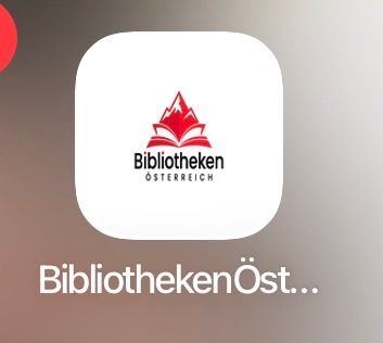 Das Bild zeigt das Logo von Bibliotheken Osterreich mit einem roten Berg, einem Buch und dem Text 'Bibliotheken Osterreich'. Das Logo hat einen weißen Hintergrund.