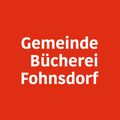 Ein roter Hintergrund mit weißem Text, der 'Gemeinde Bucherei Fohnsdorf' lautet.