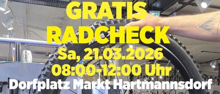 Eine Hand hält einen Fahrradreifen mit dem Text 'GRATIS RADCHECK', 'Sa, 21.03.2026', '08:00-12:00 Uhr' und 'Platz Markt Hartmanns'.
