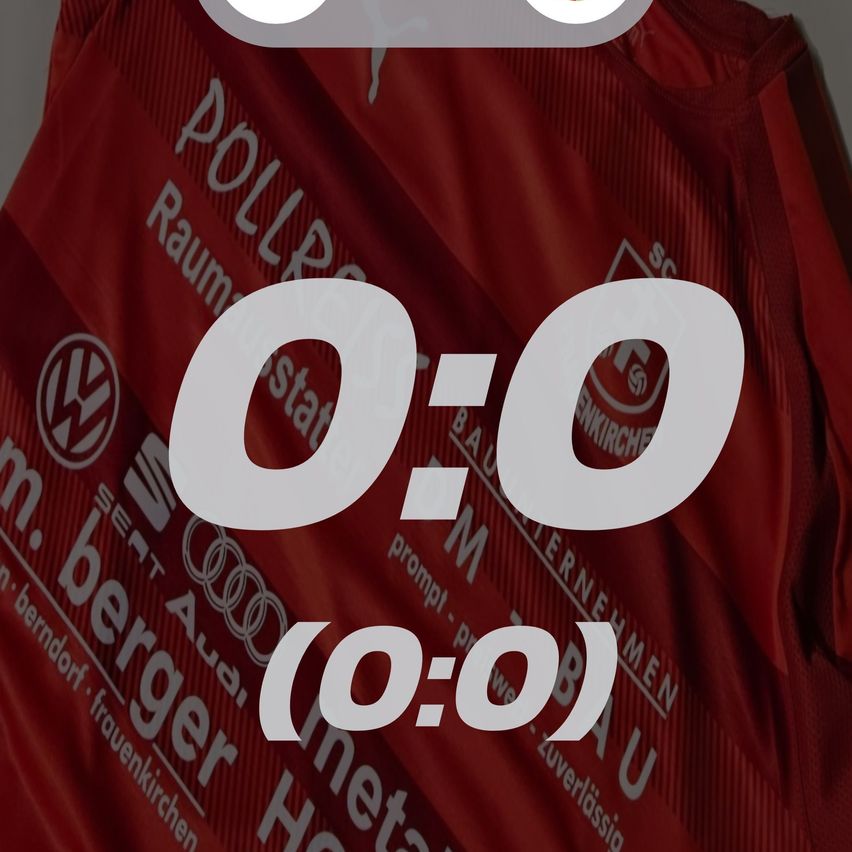 Ein rotes Fußballtrikot mit weißem Text zeigt ein Ergebnis von 0:0. Auf der linken Seite befindet sich das VW-Logo.